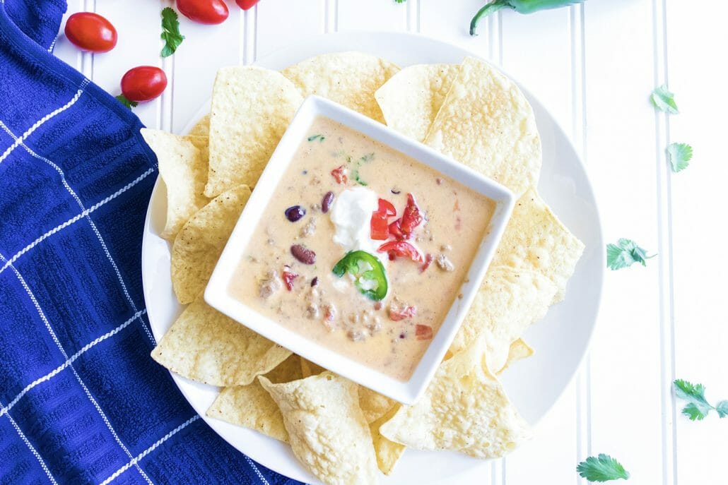 This Beer Cheese Queso Dip is one for the books! Serve it with your favorite nachos and you’ve got a summer appetizer your guests will constantly talk about (and request!) #quesodip