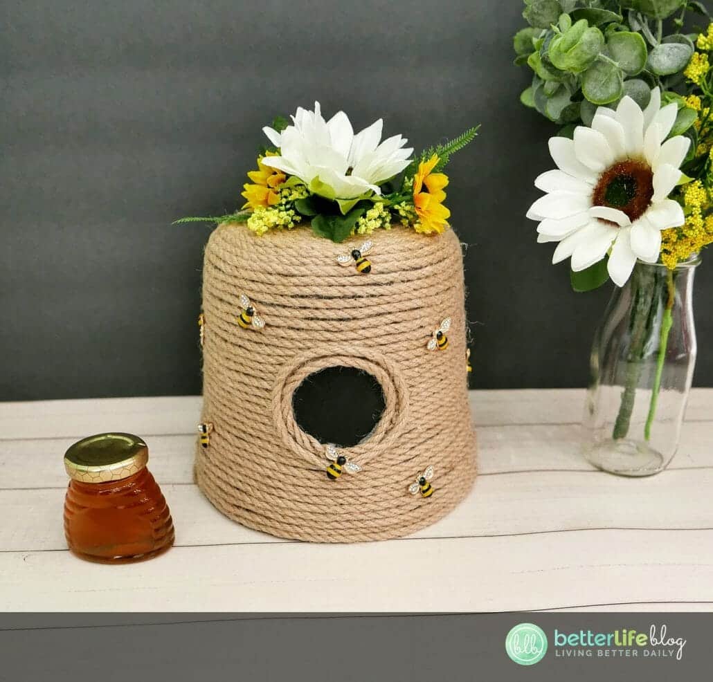 This DIY Bee Hive Craft is made with a simple flower pot and craft jute rope. All it takes is some imagination - and a lot of hot glue! This DIY is super simple and extremely cute!