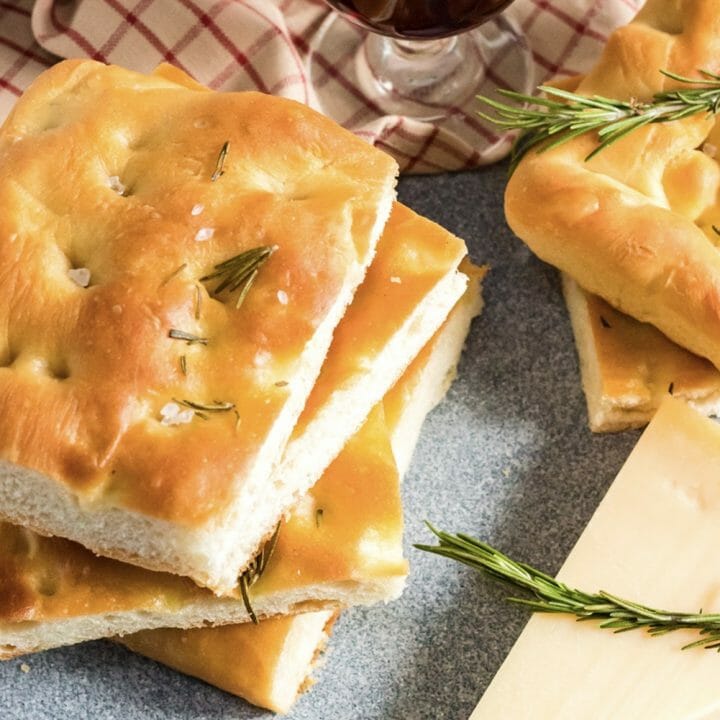 This Focaccia Bread Recipe is simple and easy! Infused with fresh rosemary and quality olive oil, this focaccia bread is gorgeous and tasty!