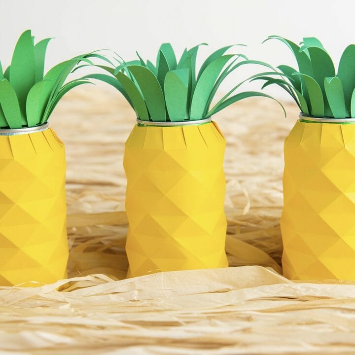 This Cricut craft is perfect for any Hawaiian-themed party. Learn how to make this Pineapple Soda Can decoration with cardstock and leftover soda cans.