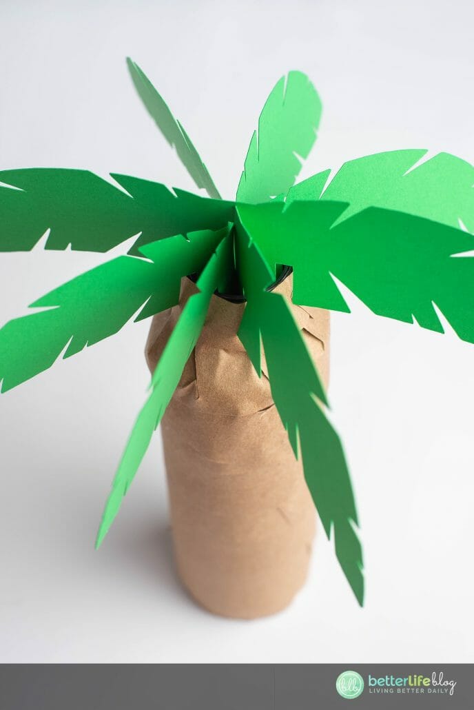 This Palm Tree Centerpiece is the perfect addition for your upcoming luau-themed party. What’s best is that it’s made using the oh-so-impressive Cricut machine. Follow my easy steps so you can DIY this cute paper craft yourself!