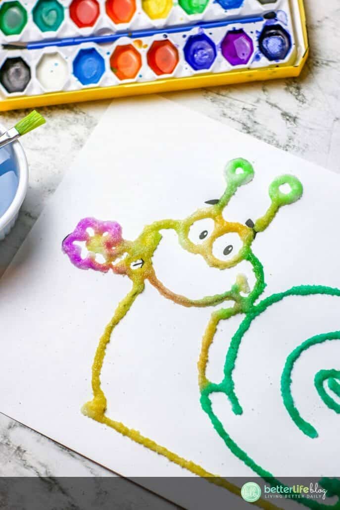 This Kids Salt Painting activity is one for the books! Super cute and very easy to make - your kids will love using all of the supplies required to complete this craft. I mean, come on: how can they resist white glue, salt and tons of paint?!