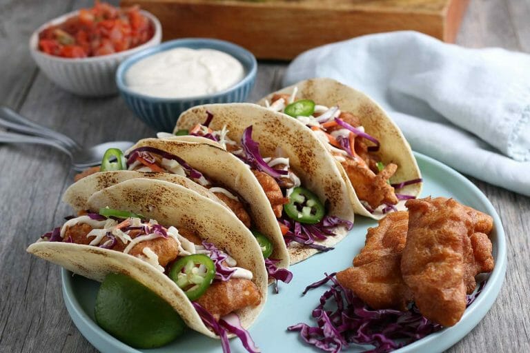 My Delicious Baja Fish Tacos Recipe is one for the books! They’re covered in a homemade batter and fried/crisped to perfection. Every bite is filled with flavor and your family will love them for your weekly Taco Tuesday nights.