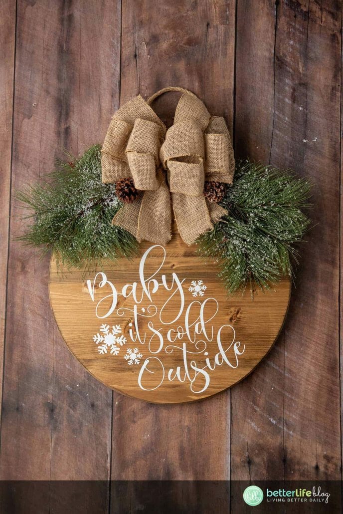 Our Farmhouse Christmas Door Sign is elegant and a offers a beautiful, rustic touch to your home. Made using a Cricut Machine, this door sign is absolutely perfect for the holiday season.