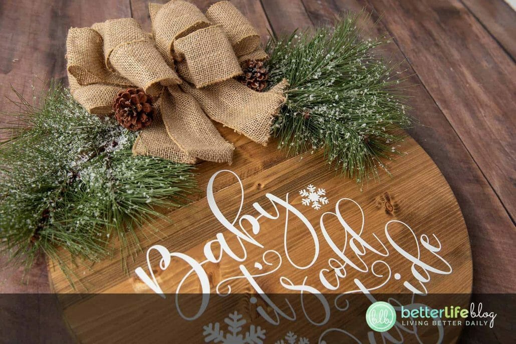 Our Farmhouse Christmas Door Sign is elegant and a offers a beautiful, rustic touch to your home. Made using a Cricut Machine, this door sign is absolutely perfect for the holiday season.
