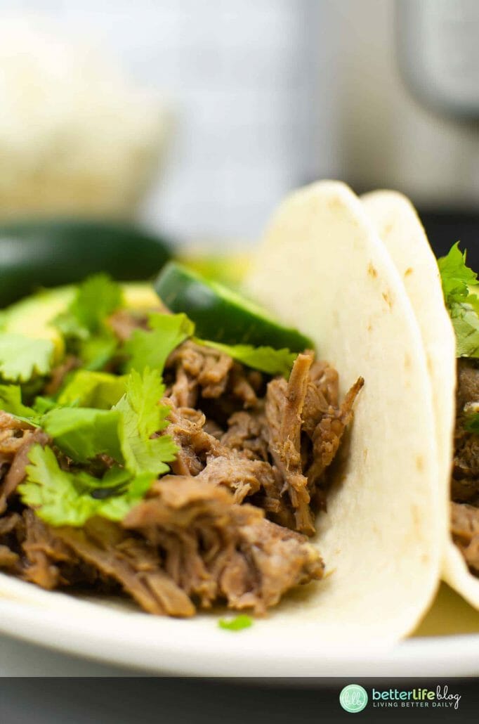 My Instant Pot Barbacoa Chipotle Copycat recipe tastes like the real deal! It’s juicy, tender and tastes amazing wrapped in a soft-shell taco, topped with cilantro and lime.