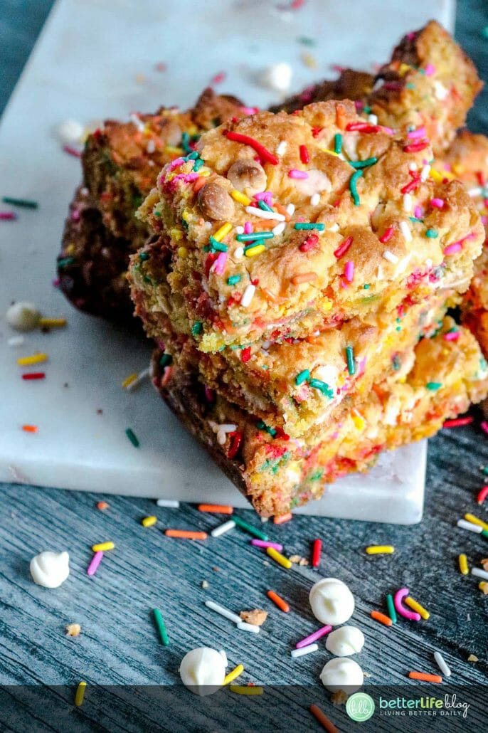 My Easy Cake Batter Blondies are a breeze to whip-up and you’ll be impressed by the sweet results! These blondies are garnished with a hefty amount of sprinkles and white chocolate chips. There’s deliciousness in every single bite and you’ll want to make a batch for your family - stat!