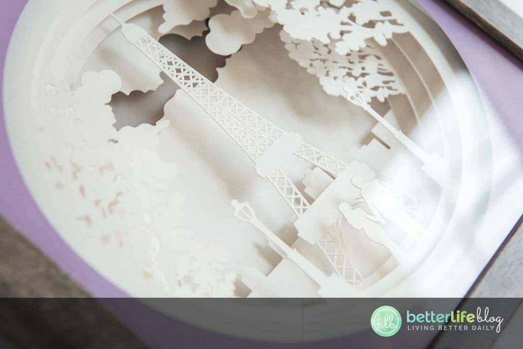 Paris, je t’aime! This beautiful Cricut Paris Shadowbox boasts a gorgeous, intricate design, backed with a glowing LED light. Check out our easy tutorial to learn how to make one of your own.