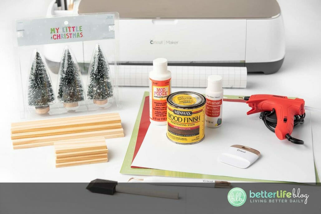 This Christmas Centerpiece is a really fun Cricut DIY! It uses permanent vinyl to give it its rustic look - a great way to add elegance to your seasonal décor.