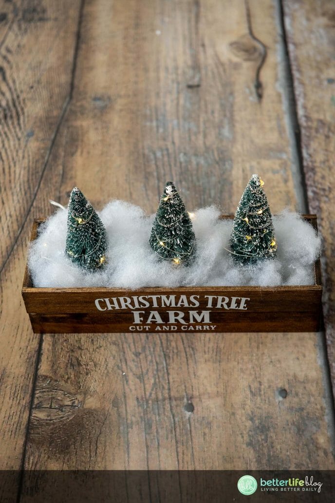 This Christmas Centerpiece is a really fun Cricut DIY! It uses permanent vinyl to give it its rustic look - a great way to add elegance to your seasonal décor.