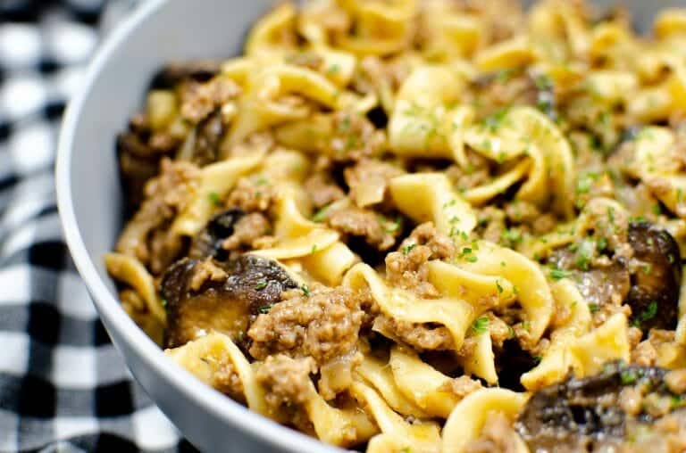 Tender beef with creamy mushrooms and onions - this Instant Pot Beef Stroganoff is full of flavor and absolute perfection! Check out my recipe to learn how to make this dish for your family tonight!