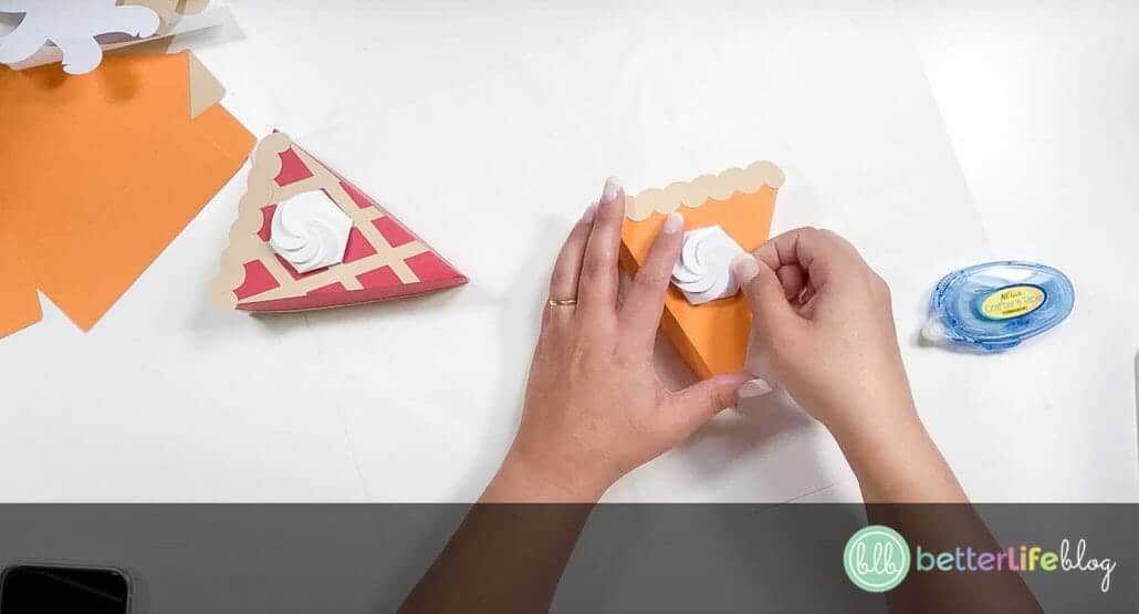 Adding a piece of white folded cardstock on top of a cardboard pie box