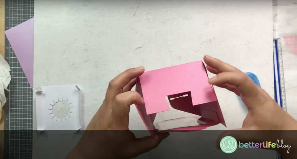 Folding in the bottom a Cupcake Holder Box made with a Cricut machine