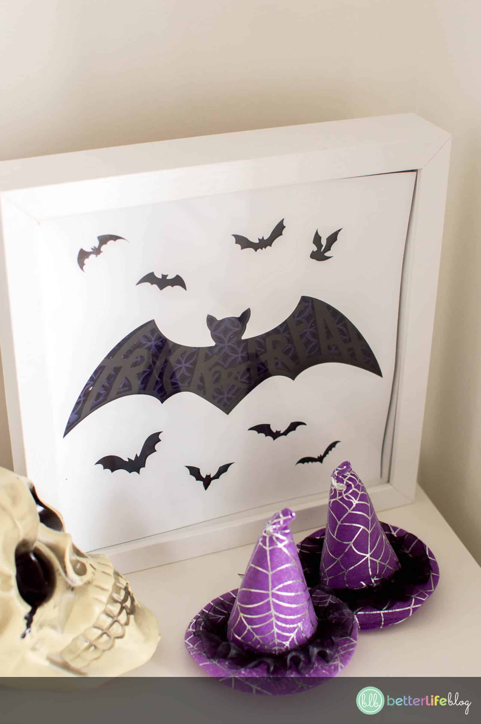 It’s time to get spooky! Learn how to put together your very own Halloween Shadow Box. This beautiful, intricate bat design boasts a “Trick or Treat” trace-out in the middle, making it perfect for light-up shadow box.