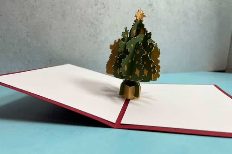 With the holiday season in full swing, I’m thrilled to give you this simple tutorial on how to make your very own Christmas Tree Pop-Up Card. It may look detailed and intricate, but it’s actually very easy to put together!