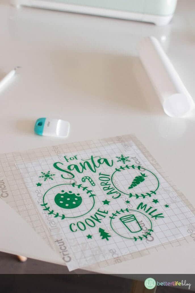 Adding transfer tape to a Santa Cookie Plate SVG Cut File, freshly weeded