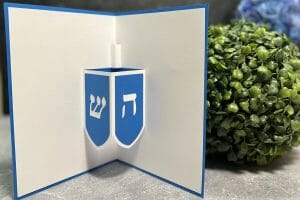 Learn how to make this adorable pop-up card for Hanukkah with my easy-to-follow Dreidel Pop-Up Card tutorial, complete with an SVG file to use with your Cricut or Silhouette!
