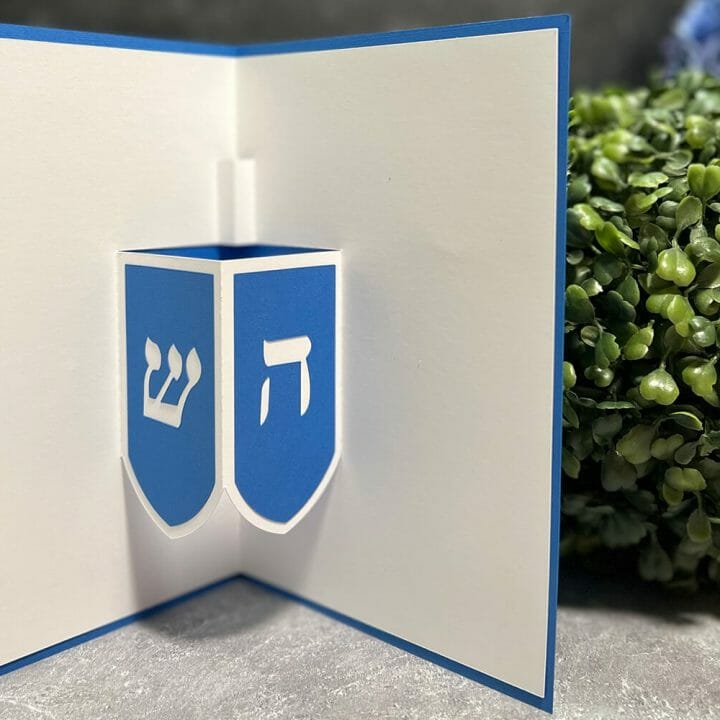 Learn how to make this adorable pop-up card for Hanukkah with my easy-to-follow Dreidel Pop-Up Card tutorial, complete with an SVG file to use with your Cricut or Silhouette!