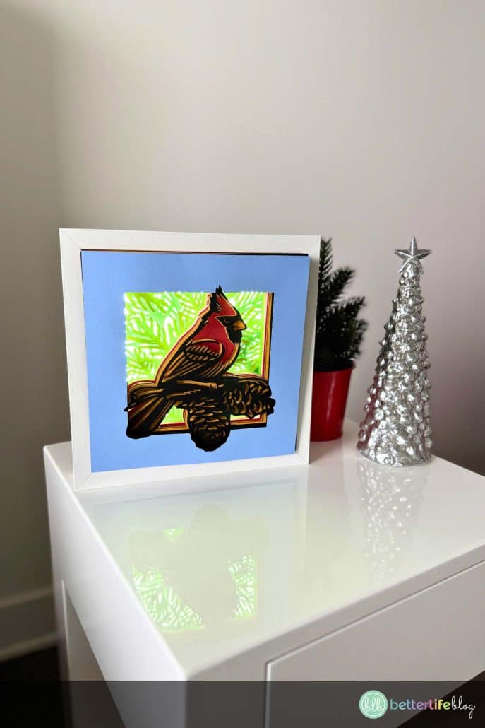 Bring the beauty of a red cardinal to life with this festive Holiday Shadow Box! This easy-to-follow Cricut tutorial uses layered cardstock to create a 3D design perfect for your holiday home décor. Download the SVG file and start crafting today!